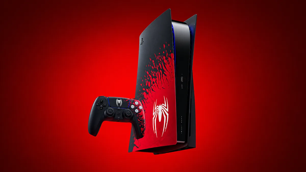 PlayStation 5 console with a black and red Spider-Man themed cover and a matching DualSense controller